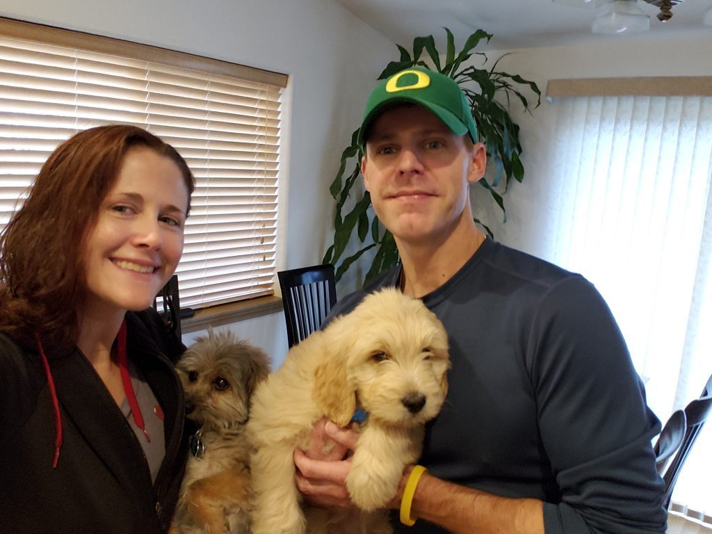 My wife and I holding our pups